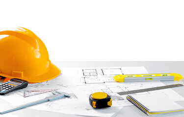 Architects concept, project house, Construction plans with yellow helmet and drawing tools on...