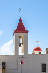 The red roofed towers of Saint John's Baptist Church in the old city of Acre, Akko Israel.
