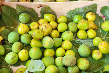 Wooden box with September white figs.