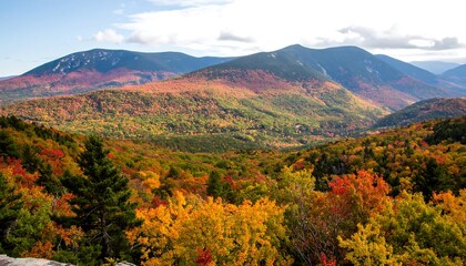Fototapeta premium A breathtaking vista of autumnal mountains, showcasing vibrant fall foliage and a serene valley nestled amongst the peaks.