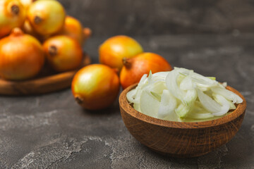 Onion on the kitchen table. onion slice. onion rings. Fresh Yellow Onion. Natural, fresh, vegetarian food. Agricultural products. Healthy eating. Vegetables. Farmer's market. Space for text.Copy space