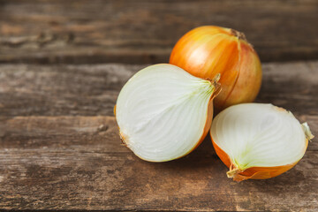 Onion on the kitchen table. onion slice. onion rings. Fresh Yellow Onion. Natural, fresh, vegetarian food. Agricultural products. Healthy eating. Vegetables. Farmer's market. Space for text.Copy space