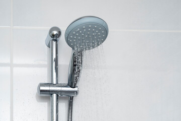 Close-up of shower watering can with water