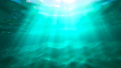 Deep blue sea with rays of sunlight breaking through the surface.