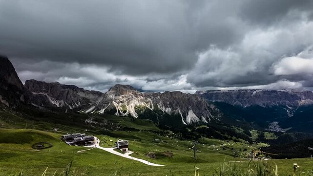 Timelapse from Seceda ridge with fast moving clouds over the Dolomites
