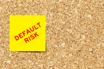 Yellow note paper with word default on cork board background with copy space