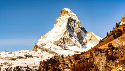 Iconic Matterhorn mountain peak in Switzerland with snowy summit. Perfect for travel posters, tourism branding, and adventure ads.