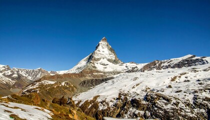 Iconic Matterhorn mountain peak in Switzerland with snowy summit. Perfect for travel posters, tourism branding, and adventure ads.