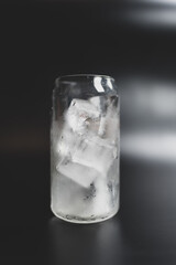 A glass filled with homemade ice cubes, prepare for cool beverage