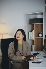 Portrait of young Hispanic professional business woman standing in office. Happy female company...