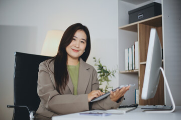 Portrait of young Hispanic professional business woman standing in office. Happy female company...