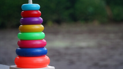 Colorful plastic rainbow toy pyramid for little kids. Educational toys, kids playground