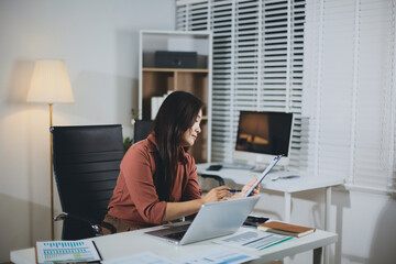 Portrait of young Hispanic professional business woman standing in office. Happy female company...