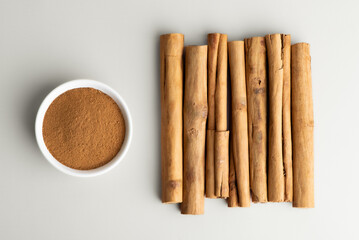 Ceylon cinnamon sticks and ground cinnamon aromatic spice. Cinnamon sticks and powder also known as...