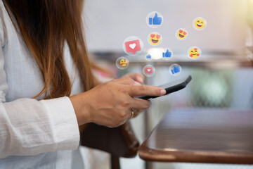 Woman using a smartphone with floating social media notification. Concept of digital communication,...