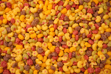 Sweet crunchy cornflakes as a background. Top view.