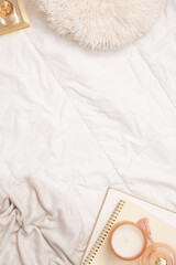 flat lay of bed with books and pillow