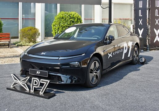 XPeng P7 electric car parked at an exhibition displaying its logo