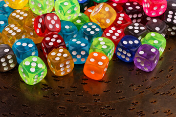 A close-up view reveals a set of dice in various colors.