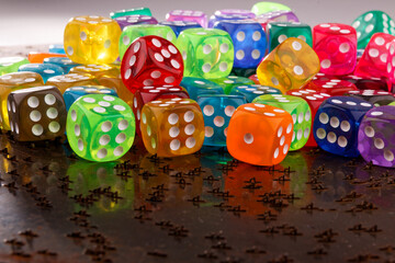 A close-up view reveals a set of dice in various colors.