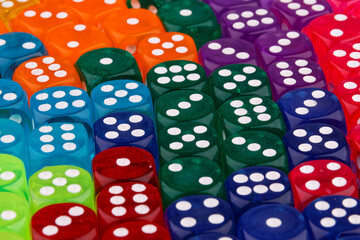 A close-up view reveals a set of dice in various colors.