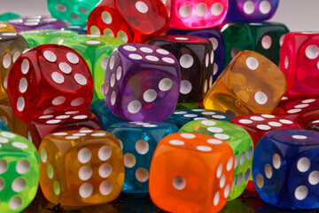 A close-up view reveals a set of dice in various colors.