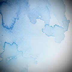 Fototapeta premium Abstract watercolor painting with shades of blue, creating a dreamy and artistic background.