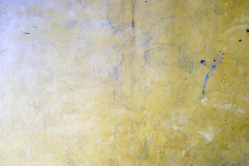 Textured Yellow Surface with Minor Imperfections and Subtle Details