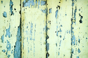 Weathered Yellow Wood Texture with Peeling Paint and Rustic Appeal