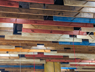 Colorful abstract geometric composition with layered rectangular shapes in blue, orange, yellow and...