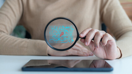 Business person holding a magnifying glass with a digital map and GPS navigation icon, symbolizing...