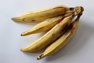 Ripe Nendran plantains in a natural bunch used in Kerala cuisine. Ideal for harvest, regional themes