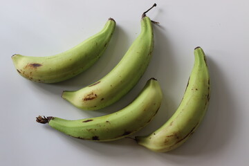 Raw plantains with dark specks, used for banana chips in South Indian cuisine