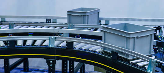 Plastic box on conveyor belt.parcels transportation system concept