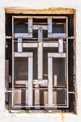 Iron cross on the window of Saint John's Baptist Church in the old city of Acre, Akko Israel.
