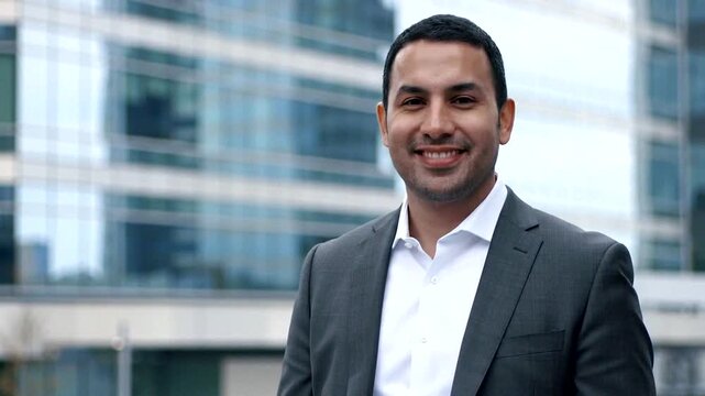 Professional man in a suit exudes confidence in a modern urban environment, embodying leadership and success.