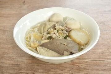 boiled vermicelli thin rice noodles topping pork ball and entrails with chop pork in clear soup on...