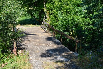 an old bridge with a wooden fence