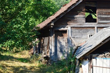 an old wooden house in a village
