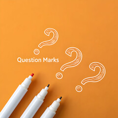 photo of handdrawn white question marks on a bold