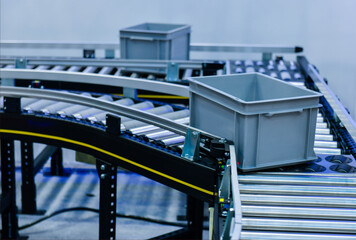Plastic box on conveyor belt.parcels transportation system concept