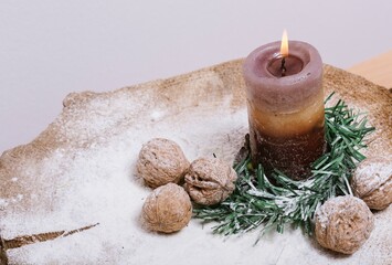 christmas still life with candle and cones
