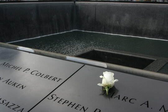 White Rose on Names at 9/11 Memorial Reflecting Pool in New York City
