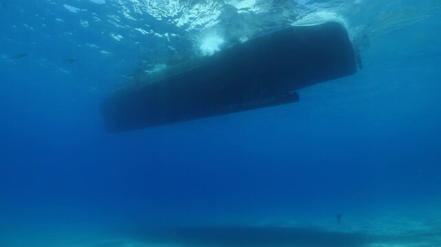 boat moves away underwater  shot
