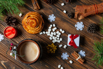 christmas cookies and spices on wooden background
