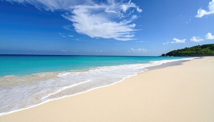 Obraz premium A serene beach with white sand and clear turquoise waters under blue skies