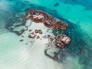 Seychelles aerial view, La Digue and Praslin. Sharp granite rock formations, transparent turquoise waters, and tropical shoreline. Exotic landscape.
