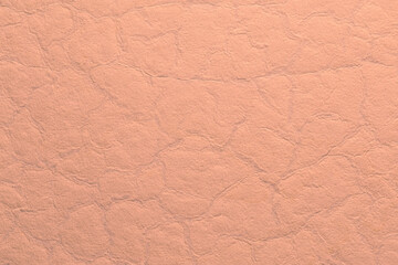 Stone texture in pale orange tones with creases and cracks to give an antique effect