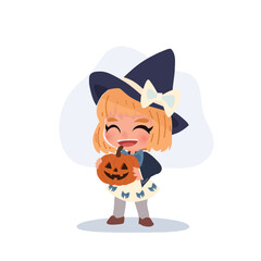 a cute little girl dressed as a witch holding a carved pumpkin jack o lantern smiling happily during halloween celebration