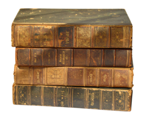 Stack of old leather bound books with worn pages and gold lettering
